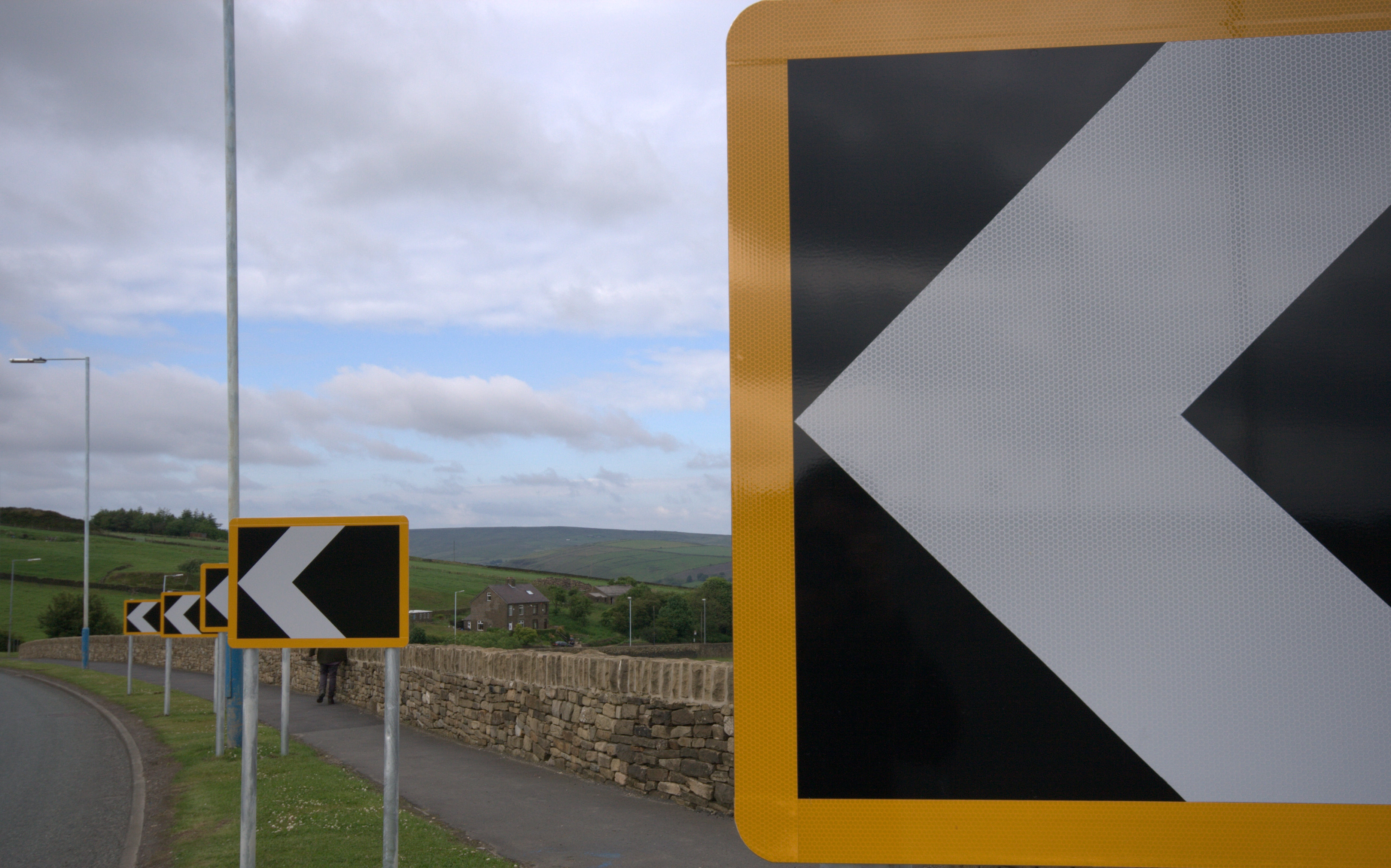 Clear signposts pointing direction at crossroads